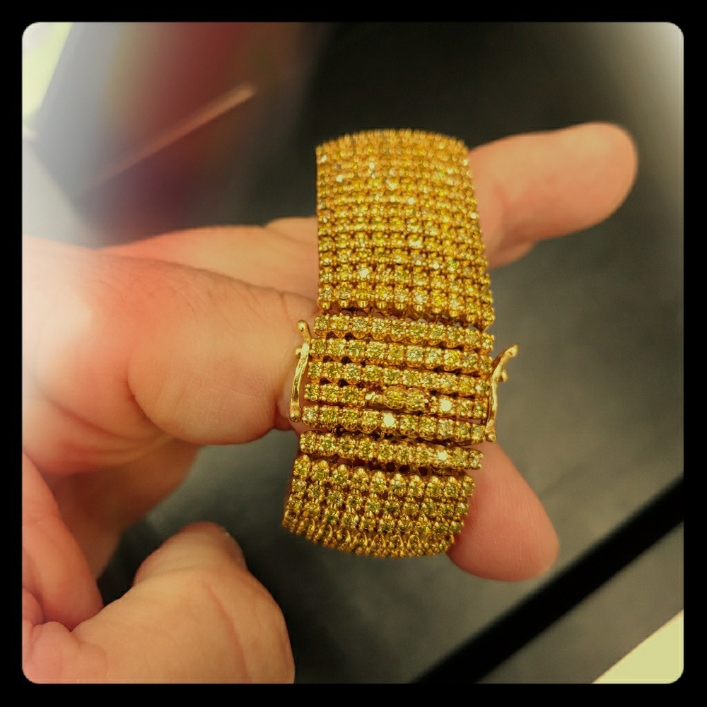 10 carat with a total of 5 carat of diamonds